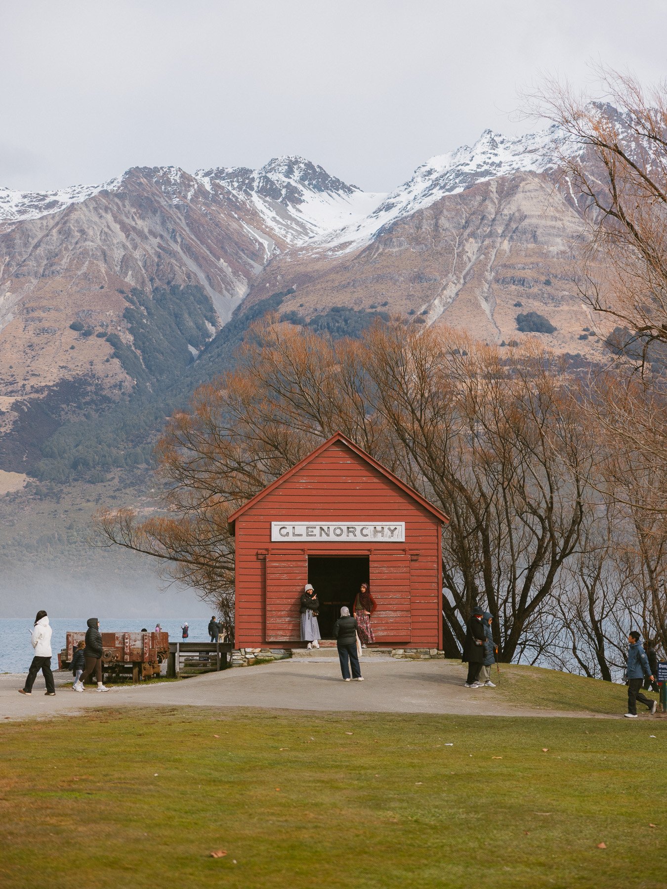 Glenorchy red shed surrounded by mountains in New Zealand